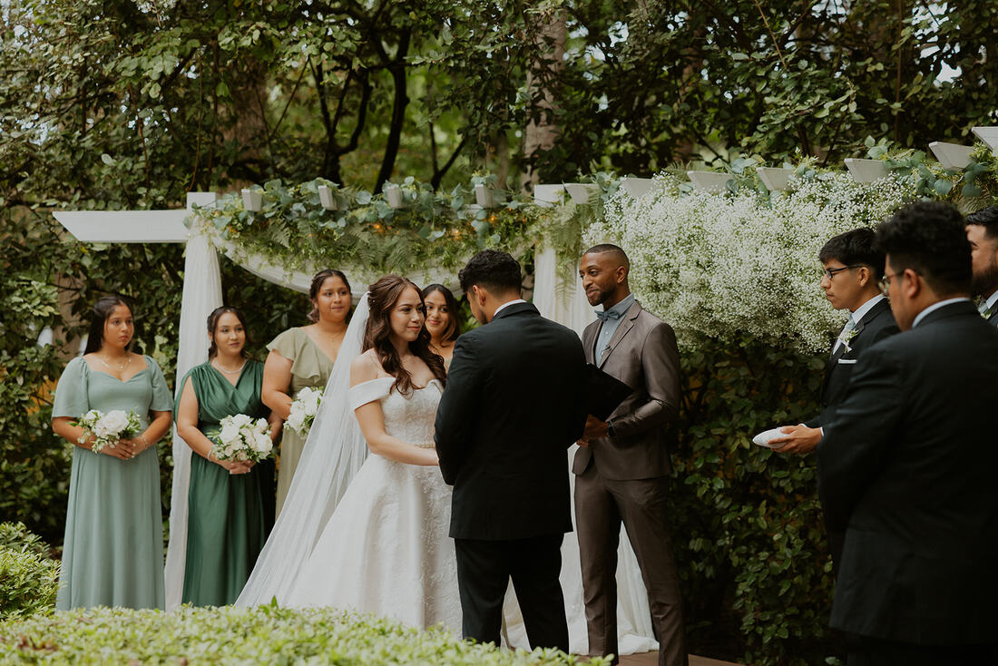 spring garden ceremony with baby's breath cloud and greenery