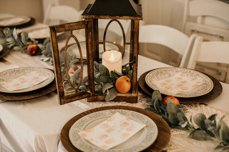 wood lantern with led candle, peaches, and lambs ear greenery