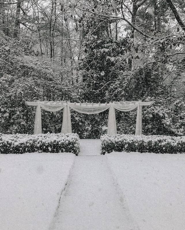 Four Oaks' outdoor wedding altar covered in snow