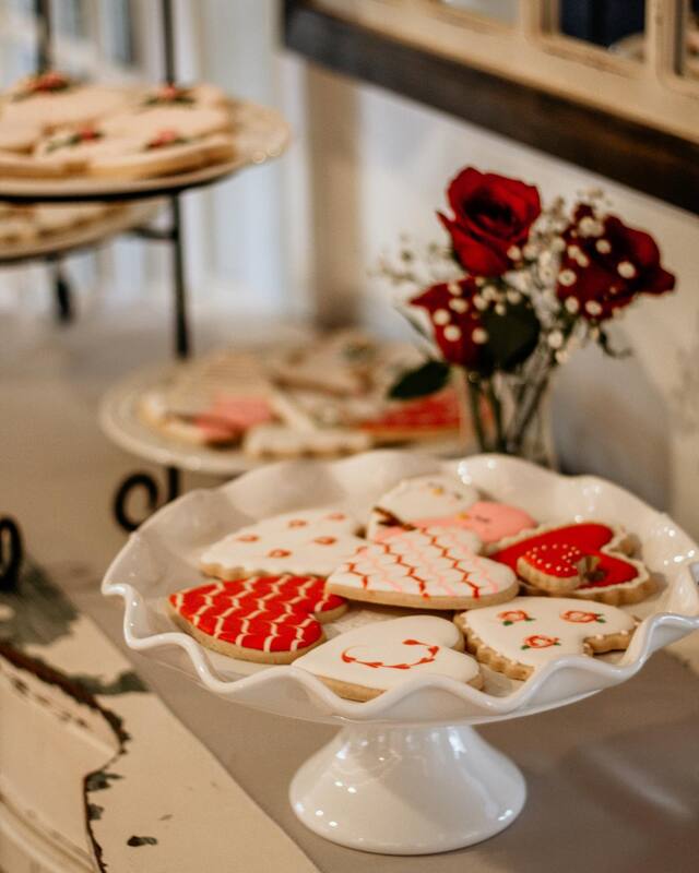heart shaped cookies with red, white and pink designs