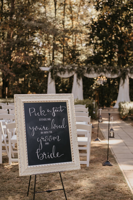 pick a seat chalkboard sign with white pane