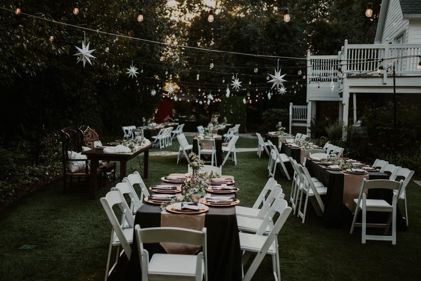 starry night wedding reception with stars hanging on bistro lights in garden venue
