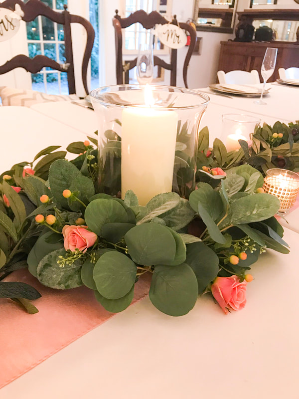glass votives with greenery centerpiece