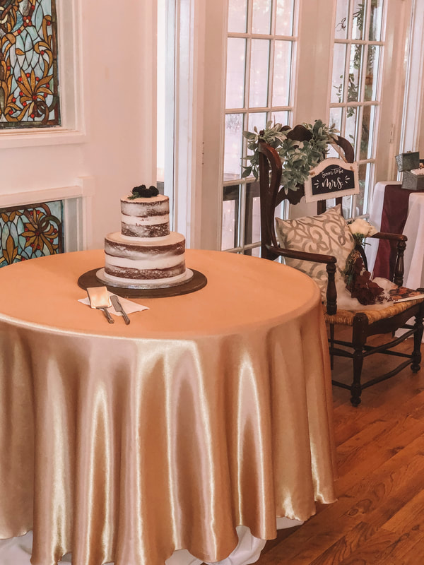 Rustic naked cake on champagne cake table bridal shower