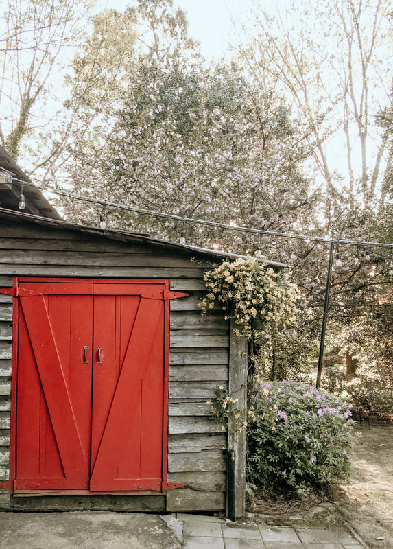 red doors of Four Oaks' smokehouse