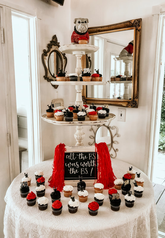 college graduation dessert bar with mini cupcakes