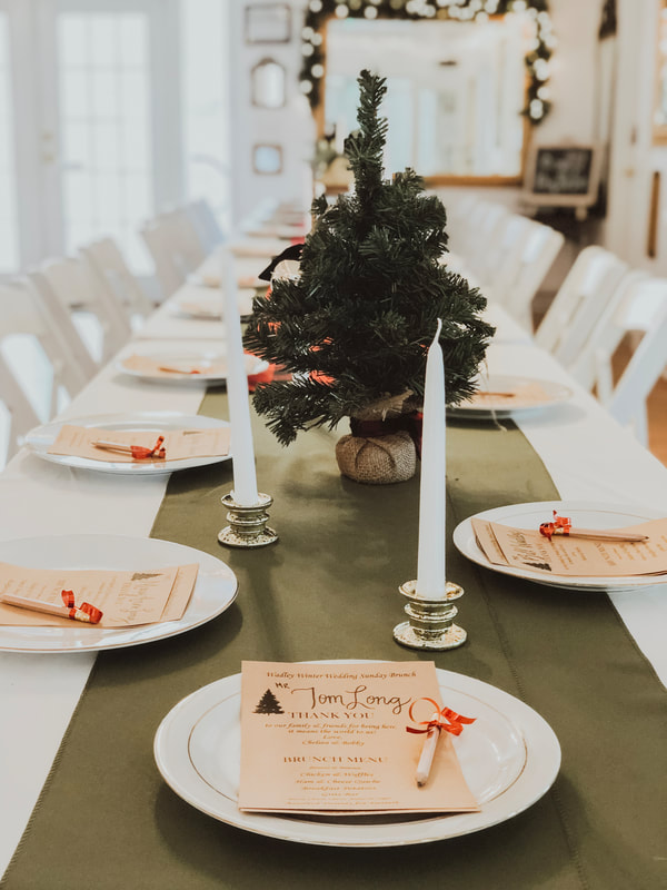 simple holiday party table decor with green runners and candles