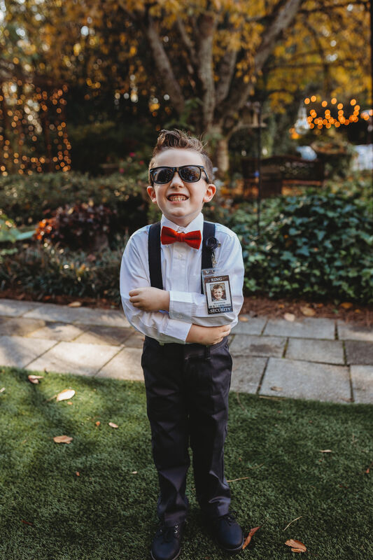 ring bearer with security badge and sunglasses