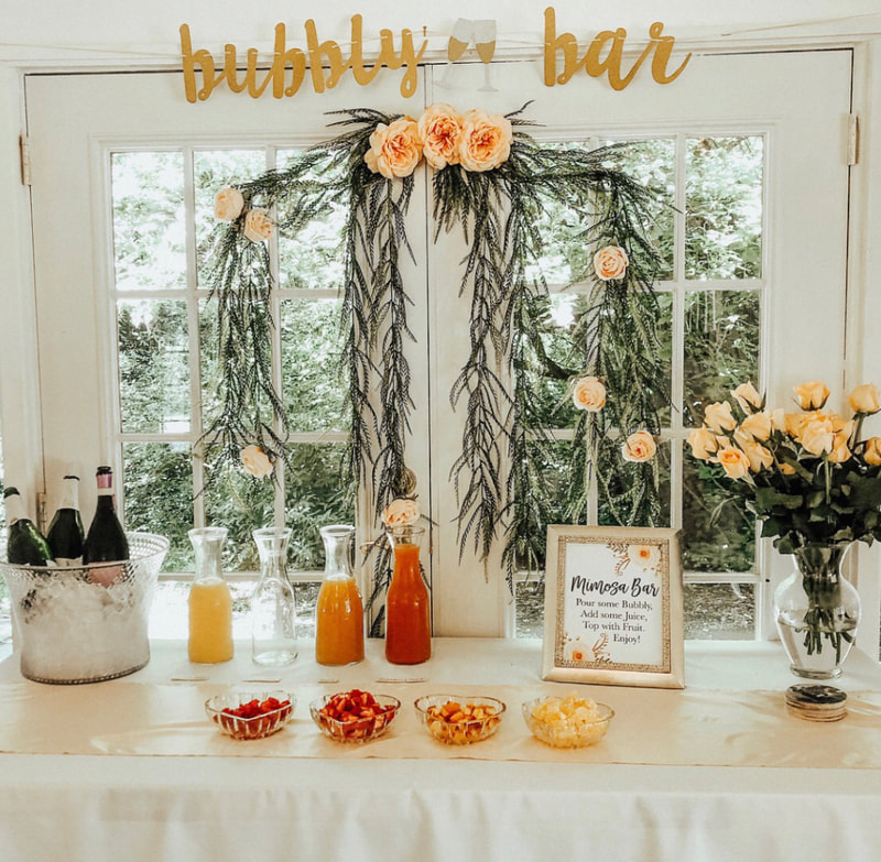 rose and peach themed mimosa bar