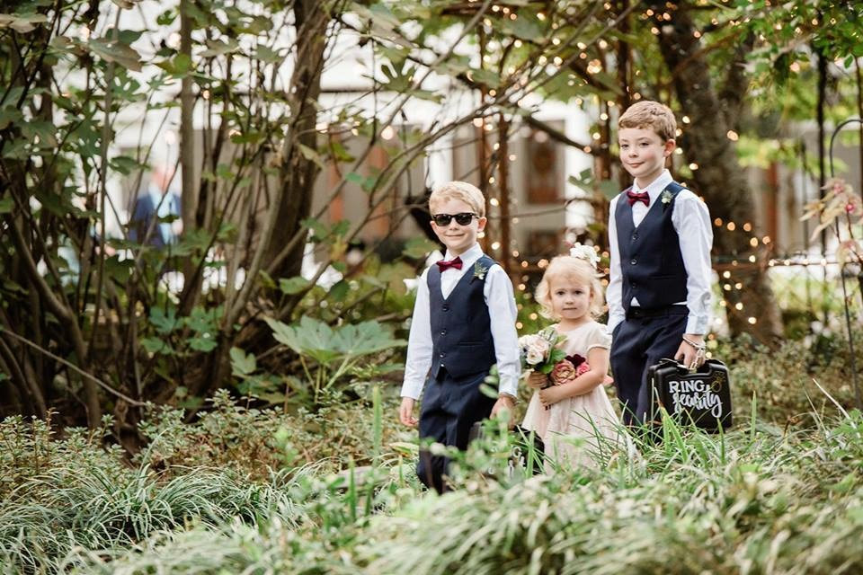 ring bearers and flower girl walking down aisle during processional