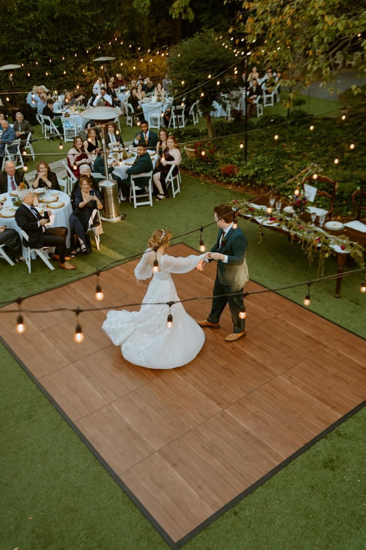 Birdseye view of newlyweds' first dance on outdoor dance floor