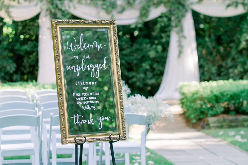 unplugged ceremony sign on gold mirror