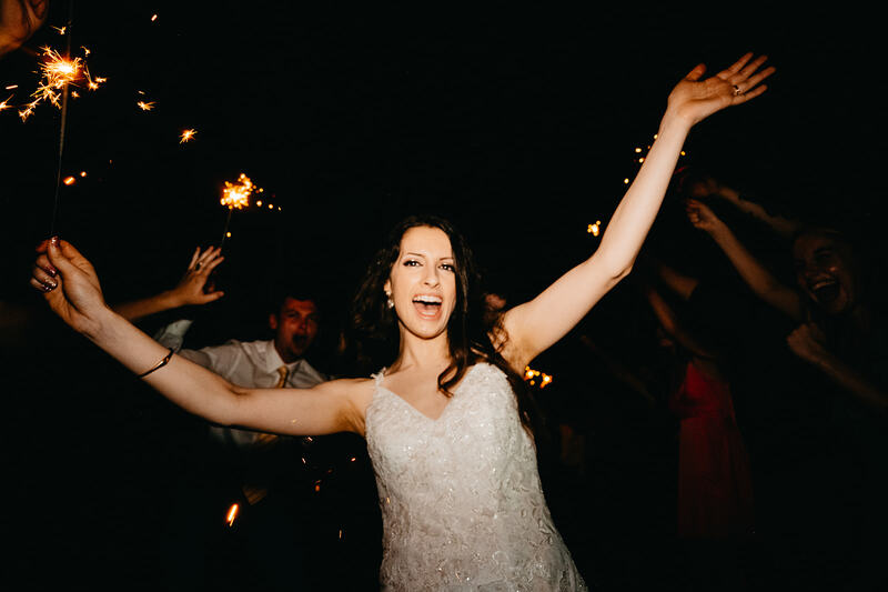 bride cheering during grand exit